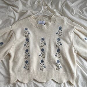 Elegant Ivory Sweater with Blue Floral Design